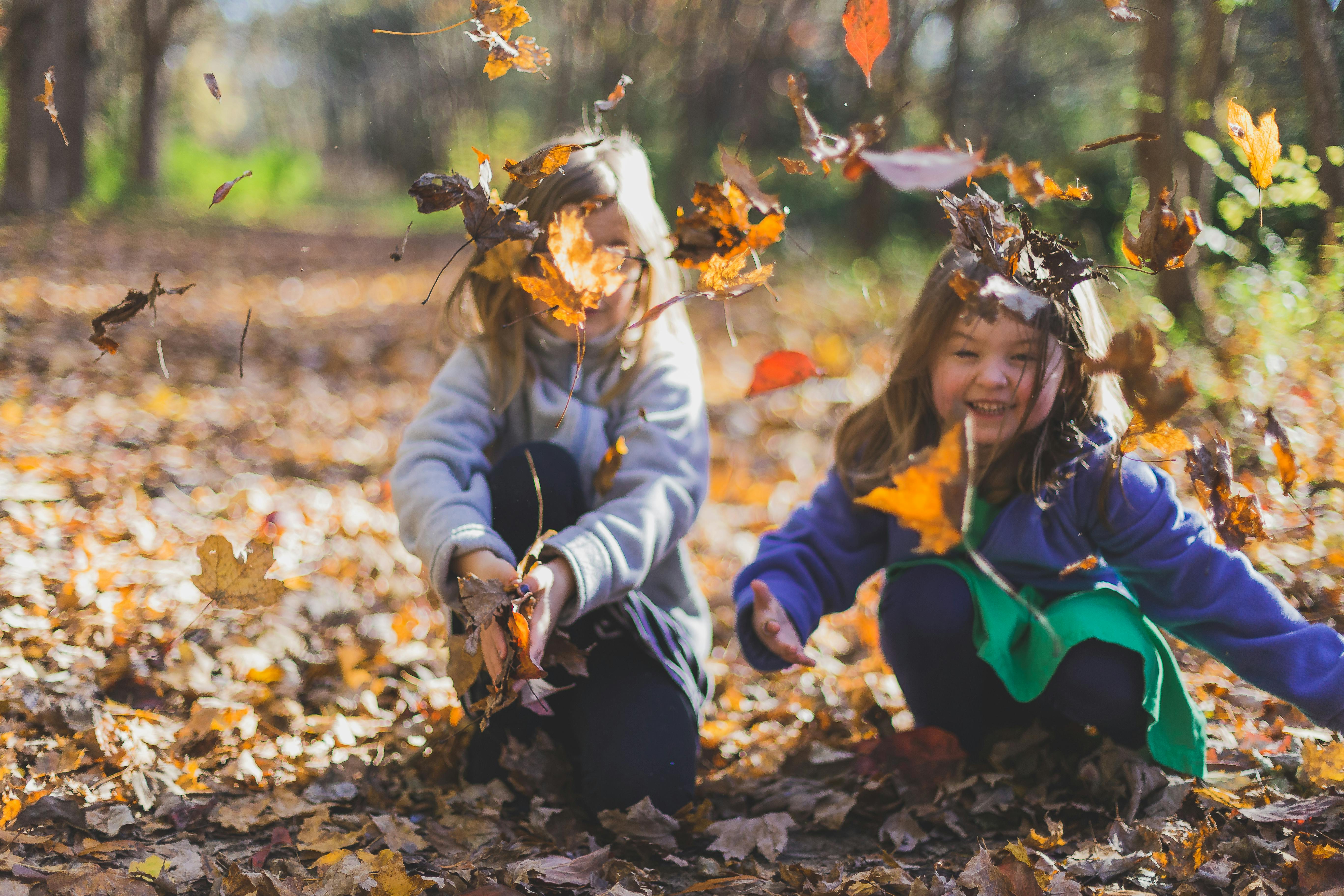 Children playing actively outdoors in nature